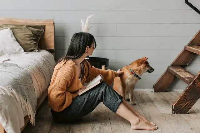 owner sitting near her dog